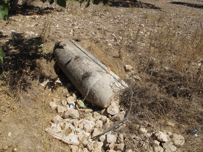 Inscribed milestone in a pit. Photo: Anja Slawisch Milestone in a pit